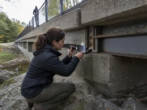 A government agency field employee inspecting public infrastructure.
